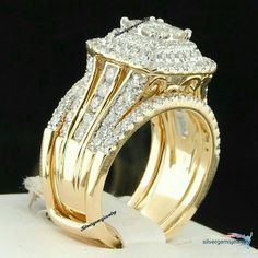 a gold ring with two rows of diamonds on it