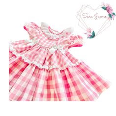 Stunning Pink And White Gingham Girl's Dress. This dress is a show stopper. Made from OEKO-TEX Earth Friendly 100% Cotton Fabric in a beautiful Blush Pink and White Colour.  The bodice is fitted and fully lined with piping along the princess seams in a contrast plain pink cotton fabric to match the back sash that ties into a beautiful big bow. The dress does up down the back with contrast self covered buttons. It also has a full gathered broderie anglaise collar with piping around the neckline and ribbon bows at the waist on the front. The sleeves are full and gathered at the shoulder and the cuff which has a contrast cuff with gathered broderie anglaise. The skirt is full and sumptuous with the top layer cut as a circle skirt and the lower layer cut on the straight with gathered broderie Gingham Dress With Ruffles For Picnic, Cute Pink Plaid Dress With Ruffles, Fitted Pink Plaid Dress For Spring, Summer Pink Plaid Ruffled Dress, Cute Short Sleeve Gingham Dress, Cute Gingham Dress With Short Sleeves, Fitted Gingham Party Dress, Fitted Gingham Dress For Party, Pink Fitted Plaid Cotton Dress