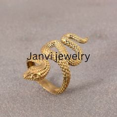 18k Gold snake ring,Snake Wrap Ring,adjustable snake ring,gold wrap ring,Gothic,Hippie,spiral ring,brass ring, Graduation Gift ,Vintage Ring Gemstone: -Na Jewelery Category:- Handmade Ring Metal:-Brass -- T H E * Q U A L I T Y We buy raw gemstones directly from miners and then get them cut and polished at our workshop , Therefore saving some bucks (additional added fees and markups) avoiding a middle man and making sure of the authenticity of the gems. And we use top quality materials that are w Gold Snake Ring As Gift, Handmade Gold Snake Ring, Gold Brass Snake Ring As Gift, Gold Brass Snake Ring For Gift, Unique Gold Snake-shaped Rings, Brass Snake Ring Open Shape Gift, Brass Snake Ring Open Design For Gift, Brass Open Snake Ring Gift, Vintage Gold Snake Ring Gift