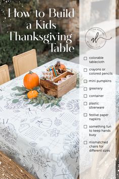 a thanksgiving table setting with pumpkins, candy and candies in a wooden box