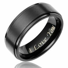 black ceramic ring with i love you engraved on the center and gold lettering inlay