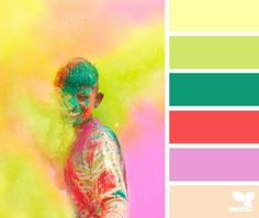 a man covered in colored powder standing next to a pink and green background with the color scheme