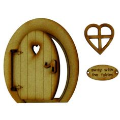 a wooden door with a heart shaped cutout and some other items to make it look like