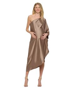 This absolutely stunning oversized asymmetrical one-shoulder dress is perfect for moms-to-be at all stages of pregnancy; including postpartum! Turn heads in this classy yet cool-mom fit this season at special events and holiday parties! Color: Satin Cocoa, Red 97% Polyester, 3% Spandex Sizes: XS/S (0-4), M/L (6-10), L/XL (12-18) Questions? Use the chat icon to connect with a stylist! Maternity Cocktail Dress, Brooke Taylor, Cocktail Dress Maternity, Stages Of Pregnancy, Chat Icon, White Maternity Dresses, Work Skirts, Casual Evening, Pregnancy Stages