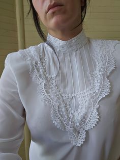 White Fitted Blouse With Lace Patchwork, Elegant Collared Lace Blouse, Fitted White Blouse With Lace Patchwork, Elegant Long Sleeve Lace Top For Formal Occasions, Elegant Lace Top For Day, Elegant Lace Work Blouse For Daywear, White Fitted Blouse With Lace Sleeves, Classic White Top With Lace Sleeves, Formal Lace Patchwork Blouse