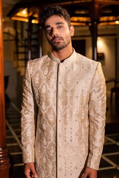 Pearl beige raw silk sherwani with all over hand embroidery, French knot detailing and mandarin collar. Paired with kurta and churidar.
Component: 3
Pattern: Hand Embroidered
Neckline: Mandarin Collar
Sleeve Type: Full Sleeves
Fabric: Raw Silk
Color: Beige
Other Details: 
Front concealed closure on sherwani
Occasion: Wedding,Destination Wedding - Aza Fashions Embroidery French Knot, Embroidered Sherwani, French Knot, Embroidered Neckline, Wedding Destination, Churidar, Full Sleeves, Embroidered Silk, Raw Silk