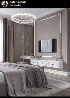 a bedroom with a bed, dresser and mirror on the wall next to a chandelier