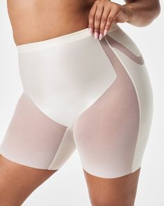 Get an instant butt lift in this shaping short designed specifically to naturally enhance and lift your behind. | Spanx Women's SPANXshape Booty-Lifting Mid-Thigh Shorts White Fitted Shapewear Briefs, White Stretch Shapewear, White Compression Bottoms, Mid-thigh Length, White Compression Mid-thigh Length Bottoms, White Shaping Shorts, Compressive White Mid-thigh Bottoms, Fitted White Brief Shorts, White Fitted Brief Shorts, White Stretch Short Length Shapewear