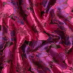 purple and pink fabric with large flowers on the bottom, as if it were made from silk