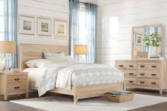 a bedroom scene with focus on the bed and dresser