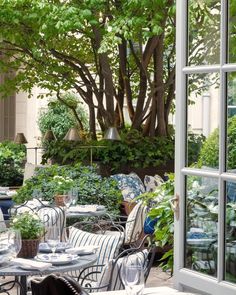 an outdoor dining area with tables and chairs