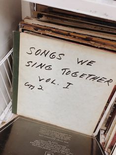 there is a sign that says songs we sing together, vol i