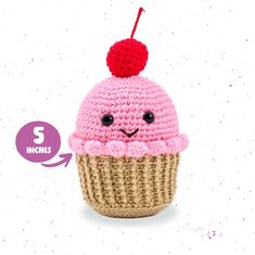 a crocheted cupcake with a cherry on top and the words 3 inches below it