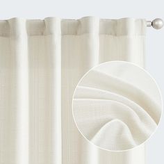 a white curtain with a silver rod on the side and an image of it in full view