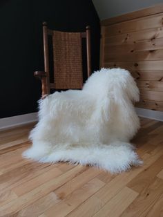 Mongolian 3-pelt sheepskin throw shown on rocking chair with a black batten wall on hickory wood floor Grey Sheepskin Rug, Large Sheepskin Rug, White Sheepskin Rug, Sheepskin Chair, Autumn Interior, White Throw Blanket, Bench Covers, Sheepskin Throw, Fur Throw Blanket