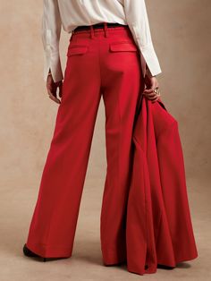 From boardroom to cocktail bar, this wide-leg trouser will have you feeling confident with an exquisitely tailored fit and a not-too-wide leg.  Crafted from a timeless all-season wool fabric from Italian mill Marzotto.  WIDE LEG FIT: High-waisted.  F Elegant Wide Leg Wool Pants, Chic Wool Pantsuit With Notch Lapel, Elegant Wool Wide Leg Pants, Elegant Wool Wide Leg Pants With Pressed Crease, Chic Wide Leg Pants With Welt Pockets, Chic Wide Leg Pants With Welt Pockets For Tailoring, Fall Wide Leg Pantsuit With Pressed Crease, Fall Wide-leg Pantsuit With Pressed Crease, Chic Wool Wide Leg Pants With Welt Pockets