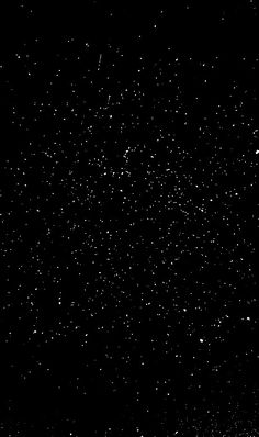 the night sky is black and white with small stars all over it, as well as an airplane flying in the distance