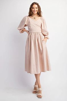 This dress features a sweetheart neckline and bubble sleeves with elasticized cuffs, as well as a smocked waistline and back. The adjustable top allows for multiple looks, and the side pockets add functionality. Its loose and flowy fit offers comfort and style. Length measures at 45.5" with a bust measurement of 14.5". Spring Flowy Puff Sleeve Dress With Lantern Sleeves, Flowy Puff Sleeve Dress With Lantern Sleeves For Spring, Billowy Long Sleeve Puff Sleeve Dress For Spring, Brunch Puff Sleeve Dress With Lantern Sleeves, Spring Billowy Puff Sleeve Dress With Lantern Sleeves, Elegant Spring Peasant Dress With Puff Sleeves, Billowy Spring Midi Dress With Lantern Sleeves, Billowy Lantern Sleeve Midi Dress For Spring, Casual Dresses With Pleated Balloon Sleeves