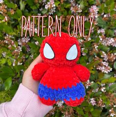 a hand holding a red, blue and white spiderman crochet toy with the words pattern only on it