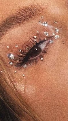 a woman's eye with glitter on it