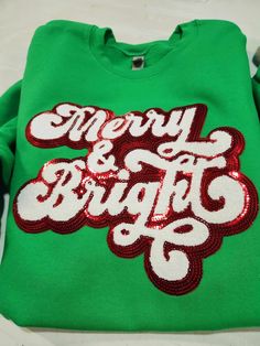 Merry and Bright Sweatshirt, Sequin Christmas Sweater, Chenille Patch Sweatshirt, Merry Christmas Shirt, Happy Holidays Shirt, Plus Size Merry and Bright Sweatshirt features a festive and sparkley design.  This green Christmas sweatshirt is great on a soft unisex tee or christmas sweatshirt.  **SIZE CHART** SHOWN IN 5TH LISTING PICTURE ABOVE ORDERING INSTRUCTIONS PLEASE CHECK YOUR SIZE BY USING THE SIZE CHART LOCATED IN THE 4TH LISTING PICTURE ABOVE. PLEASE SELECT YOUR SHIRT COLOR FROM THE DROP Sparkly Christmas Tshirt, Party Season Sequined Crew Neck T-shirt, Merry And Bright Sweatshirt, Womens Merry Christmas Tree Sweatshirt Chicmiky, Custom Sports Shirts, Sequin Crew Neck T-shirt, New Years Eve Shirt, Volleyball Mom Shirts, Reindeer Shirt