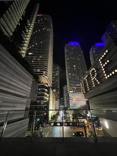 some very tall buildings at night time