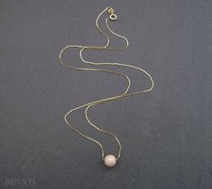 "New and exclusive to Benati. A very elegant round bead necklace, floating gracefully on a dainty solid 14k gold chain. Crafted to perfection in 14k solid gold. The pendant is hanged on a elegant, delicate and dainty gold 'box' approx. 0.6mm chain. if you wish for a thicker chain approx. 0.8mm chain, you can choose so at the checkout process. The pictures are of the approx. 0.6mm gold chain. You or your friend will look super fine with this new exclusive design - by Benati. The size of the round Elegant Ball Chain Necklace For Formal Occasions, Elegant Formal Necklace With Ball Chain, Elegant Formal Ball Chain Necklace, Gold Pendant Necklace With Ball Chain, Elegant Gold Beaded Necklace With Tiny Beads, Yellow Gold Necklaces With Round Beads, Yellow Gold Beaded Necklaces For Formal Occasions, Elegant Yellow Gold Chain Necklace With Gold Beads, Formal Yellow Gold Beaded Necklaces