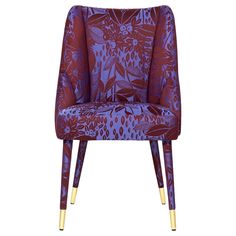 an upholstered chair with gold legs and purple floral print on the back, in front of a white background