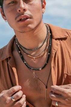 Classic black lava bead necklace with silver accents. Designed to be gender inclusive, this lava necklace is a Hawaii staple. Choose your length for the perfect fit.Bryson is wearing the 24 inch Length.✦ DETAILS �✦✧ Name: Kalama (ee-KIE-kah) - man of strength.✧ 8mm black lava beads.✧ Sterling Silver Hook and Eye Clasp.✧ Silver plated base metal accents.✧ All Ke Aloha Jewelry pieces come packaged thoughtfully, beautifully, and ready for gift giving.✧ Unless otherwise noted in the listing descripti Dream Photoshoot, Hawaii Necklace, Long Leather Necklace, Beach Mood, Hawaiian Necklace, Mens Leather Necklace, Classic Pearl Necklace, Hawaii Jewelry, Black Leather Necklace