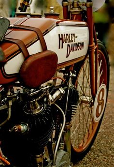 an old harley davidson motorcycle parked on the street