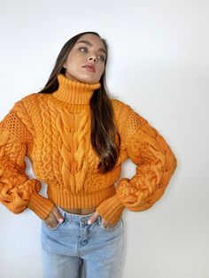 Cropped soft women's hand knit fall sweater in merino wool mixture, with long sleeves and a high turtleneck collar. The photo shows a merino wool mixture pullover in color 837. Model's height is 170cm, sweater size S- M. You can order this sweater in any color shown in the palette in the photo and in your size: XS - S: length - 45 cm, width - 50 cm. S - M: length - 46 - 47 cm, width - 52 - 53 cm. M - L: length - 47-48 cm, width -54 - 56 cm. XXL: length - 50 cm, width - 57-58 cm. XXXL: length - 52-53 cm, width - 60 cm. You can create a sweater according to your measurements, just enter them in the personalization section Hand Knitted Merino Wool Sweater For Fall, Fall Chunky Knit Merino Wool Sweater, Fitted Wool Cropped Sweater For Winter, Fall Cable Knit Long Sleeve Cropped Sweater, Cozy Knit Cropped Sweater For Fall, Fitted Orange Knit Sweater, Fall Acrylic Knitting Pattern, Fall Wool Chunky Knit Pattern, Chunky Knit Merino Wool Knitting Pattern For Fall