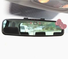 a hello kitty car mirror hanging from the ceiling