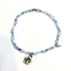 Ocean Blues Crystal Seed Beaded Flower Charm Anklet Or Bracelet Handmade Item Length: 9.5 Inches Materials: Seed Beads And Crystals Gemstone: Seed Beads In Shades Of Blues And Greens Jewelry Style: Minimalist #Anklet #Beadedbraclet #Stretchbracelet #Handmade #Flower Charm Blue Flower Bracelets For Beach, Blue Flower Beaded Bracelets For Beach, Blue Beaded Chain Bracelets For Beach, Blue Beaded Bohemian Anklets, Bohemian Blue Beaded Anklets, Casual Blue Flower-shaped Beaded Bracelets, Blue Beaded Chain Anklets For Gift, Blue Beaded Chain Anklets As Gift, Blue Flower Beaded Bracelets For Summer