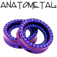 two purple balls are stacked on top of each other in front of the words anatometal