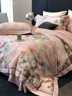 a bed with pink and white flowers on it