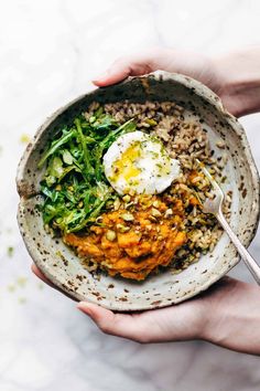 A bowl filled with mashed turmeric sweet potatoes, quinoa and rice, arugula, pistachios and a poached egg. Healing Bowls, Egg Benedict, Buddha Bowls Recipe, Red Quinoa, Healthy Bowls, Poached Egg, Mashed Sweet Potatoes, Deviled Eggs, Poached Eggs