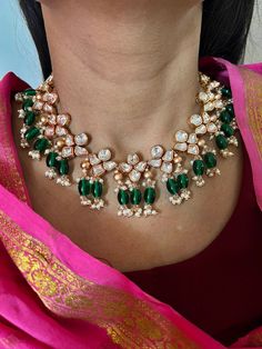 A perfect piece for your next wedding occasion! Adorn yourself with this gorgeous Kundan Jewellery piece. Handcrafted by our skilled Indian craftsmen from Jaipur  Length of earrings: 6 cms Materials: Brass Copper mix, kundan stones, green beads, gold plated  It can be worn both as a necklace and a choker. The necklace and earrings are the same as shown in the pictures. We have only one piece in this color and design, hence you get what you see in the pictures. Anniversary Kundan Necklace With Tilla Detailing, Kundan Chandbali Necklace For Anniversary, Chandbali Kundan Necklace For Anniversary, Traditional Green Necklace For Anniversary, Traditional Green Necklaces For Anniversary, Fusion Style Green Bridal Necklace With Hand Set Details, Fusion Style Green Bridal Necklace With Hand Set, Green Temple Jewelry Necklace For Anniversary, Kundan Necklaces For Wedding