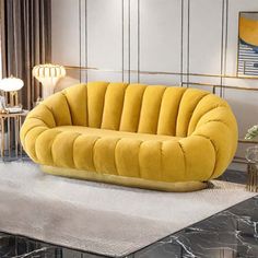 a yellow couch sitting on top of a white rug