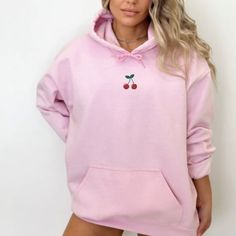 Get ready to fall in LOVE with your new embroidered cherry hoodie. It's the cutest and most comfortable way to wear the latest styles. * PRODUCT DETAILS * ✺ 50% cotton, 50% polyester ✺ Medium- heavy weight fabric ✺ Wash and dry normally (on cool for best results) ✺ Designed and printed in the USA ✺ Due to different monitor screens, colors may vary ✺ * SIZING * ✺ FOR AN OVERSIZED FIT, SELECT TWO OR THREE SIZES UP FROM YOUR NORMAL SIZE ✺ ✺ Sizing is unisex ✺ Size guide: Please consult size chart i Pink Sweatshirt With Embroidered Logo For Spring, Spring Casual Hoodie With Embroidered Logo, Casual Spring Hoodie With Embroidered Logo, Hooded Sweatshirt With Custom Embroidery For Fall, Trendy Embroidered Logo Hoodie For Fall, Pink Embroidered Hoodie For Fall, Trendy Fall Hoodie With Embroidered Logo, Casual Hoodie With Custom Embroidery For Fall, Cute Winter Hoodie With Embroidered Graphics