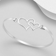 This Beautiful Piece Of Fine, 925 Sterling Silver Hearts Bangle 7" Will Add A Touch Of Beauty To Your Wardrobe And Makes A Great Statement Piece If You Are Wanting To Let Your Significant Other Know Just How You Feel About Them. Sterling Silver Double Heart Bracelet, Anniversary Bracelet With Sterling Silver Clasp For Valentine's Day, Sterling Silver Clasp Bracelet For Valentine's Day Anniversary, Valentine's Day Anniversary Bracelet With Sterling Silver Clasp, Sterling Silver Double Heart Bracelets, Silver Open Heart Bracelet For Anniversary, Sterling Silver Open Heart Bracelet For Anniversary, Adjustable Heart-shaped Sterling Silver Bracelet For Anniversary, Sterling Silver Open Heart Wedding Bracelets