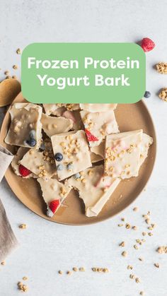 frozen yogurt bark on a plate with berries and granola