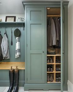 a green closet filled with lots of coats and shoes