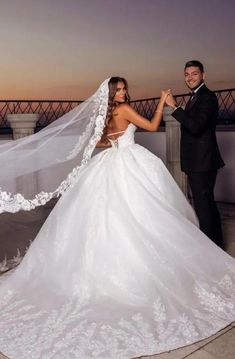 a bride and groom posing for a photo