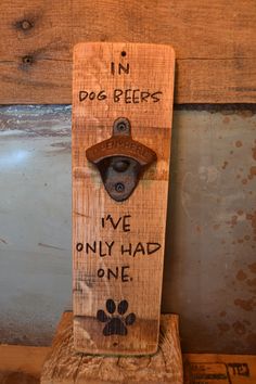 a wooden sign that says, in dog beers we only had one paw on it