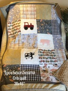 a quilted blanket with farm animals on it and the words love sewns crib quilt