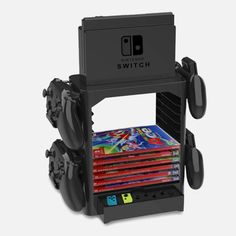 the nintendo switch is stacked on top of each other with games in it's holder