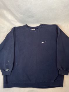 Size 2XL but please check measurements. Measurements: Armpit to armpit: 27” Long: 30” Shoulder to cuff: 22” Please look at all photos closely as they are part of the detailed description. Feel free to ask any questions and thanks for looking! Nike Vintage Pull, Nike Athletic Vintage Sweatshirt, Vintage Jumpers Nike, Blue Crew Sweatshirt For Sports Events, Blue T-shirt For Winter Sports, Casual Navy Sweatshirt For Sports Events, Blue Crew Neck Sweatshirt For Sports Events, Blue Tops With Ribbed Cuffs For Sports Events, Blue Crew Sweatshirt For Sports