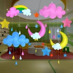 a room filled with lots of colorful clouds and stars hanging from the ceiling