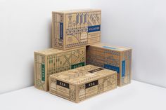 four boxes stacked on top of each other in different sizes and colors, with the box labeled kaa