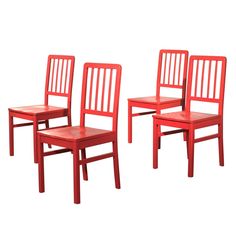 three red wooden chairs sitting next to each other